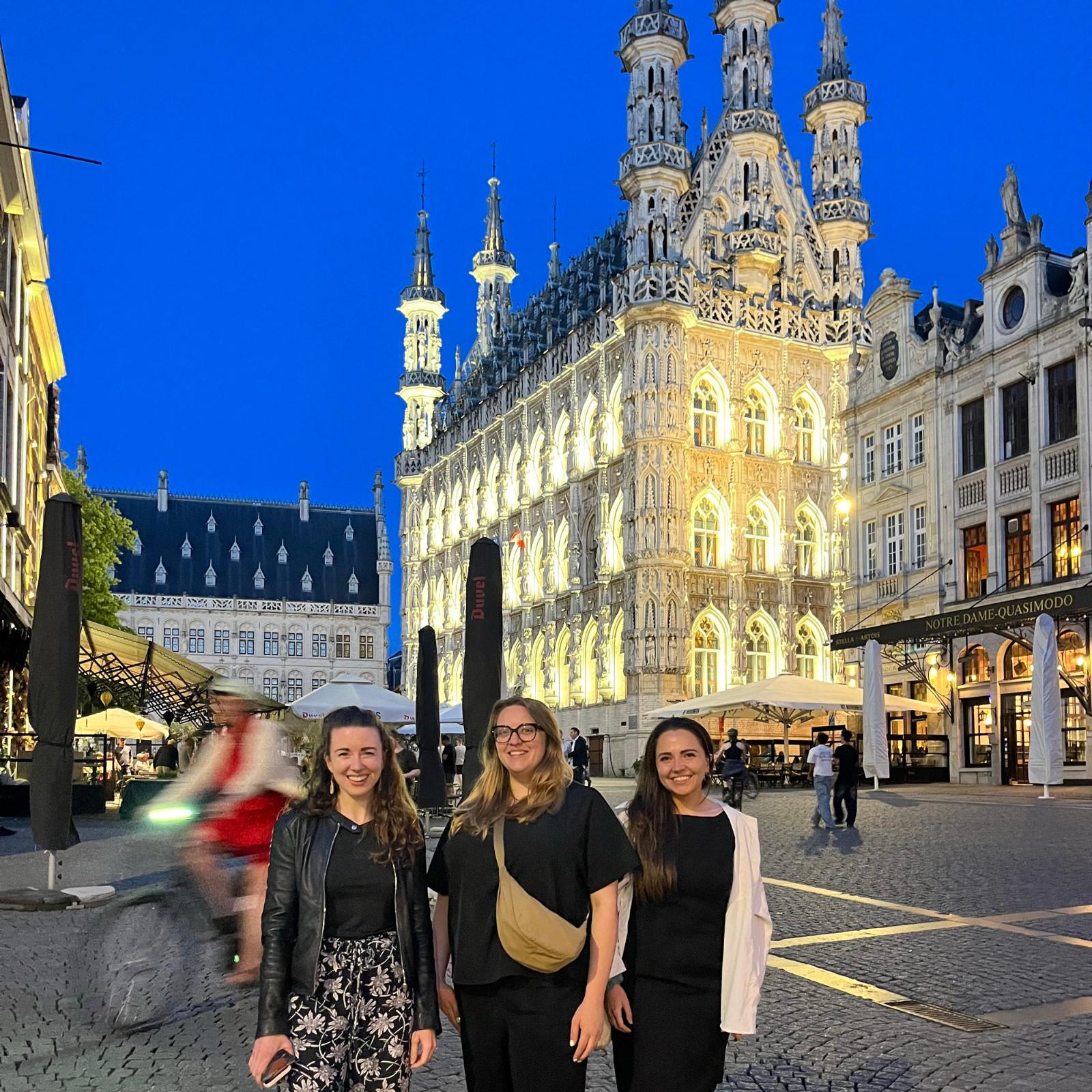 Three ECRS standing in front of Leuven Stadhuis
